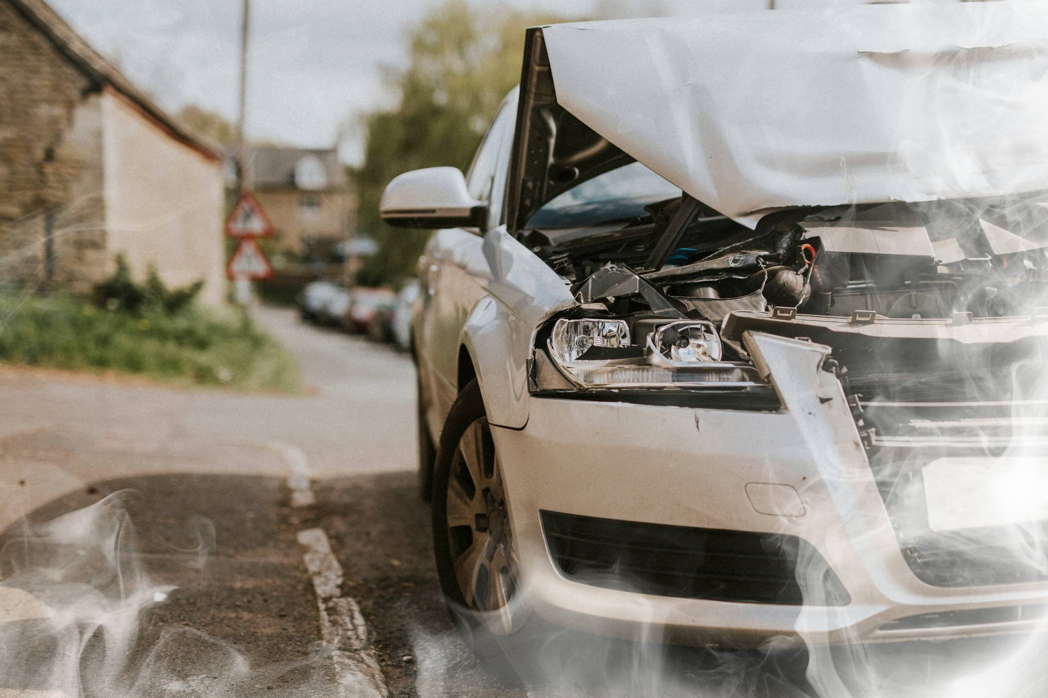 Orlando Car Accident Attorney - White smoke rising from a car that had been in a crash