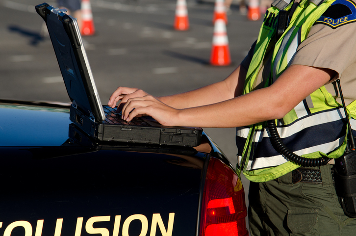 Police officer working on a police report after a crash - can you claim a car accident without a police report?